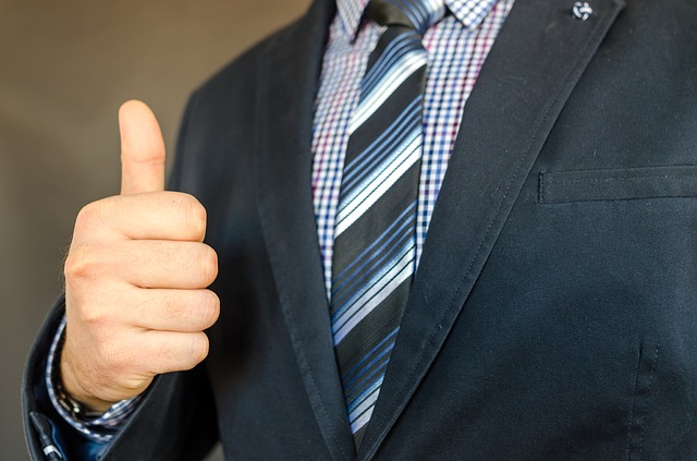 Businessman thumbs-up right hand